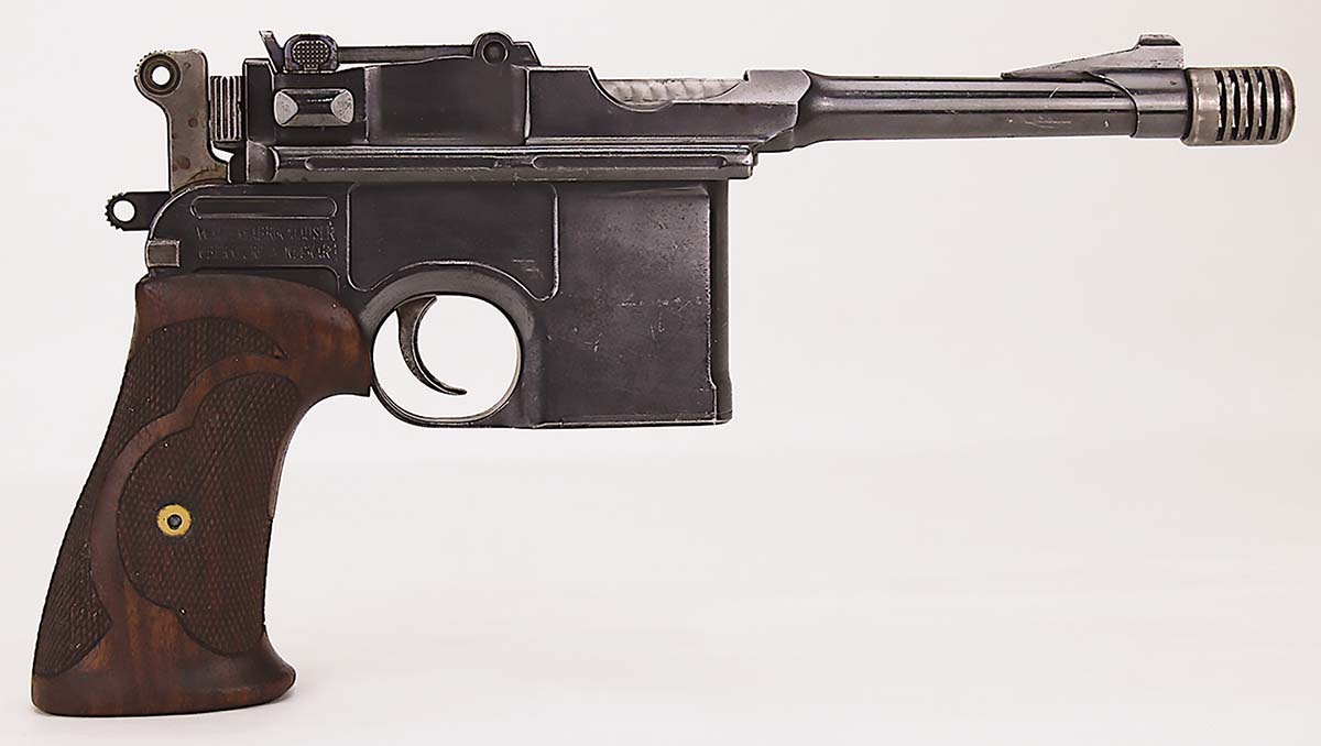 Modifications include much-improved grips, a compensator, a ramp front sight and bolt jewelling.
